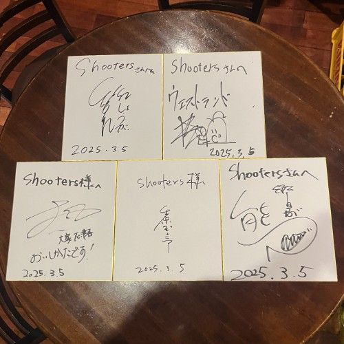 A table with a bunch of signed cards on it