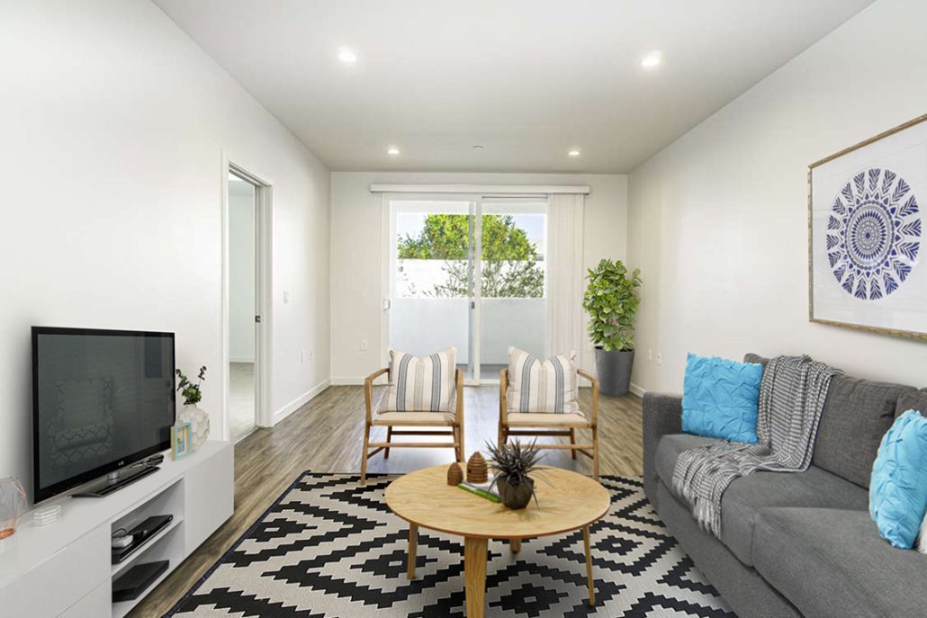 A living room with a couch , chairs , table and television.