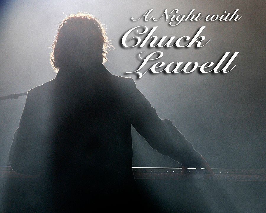 Keyboardist Chuck Leavell silhouetted against stage lights; event title