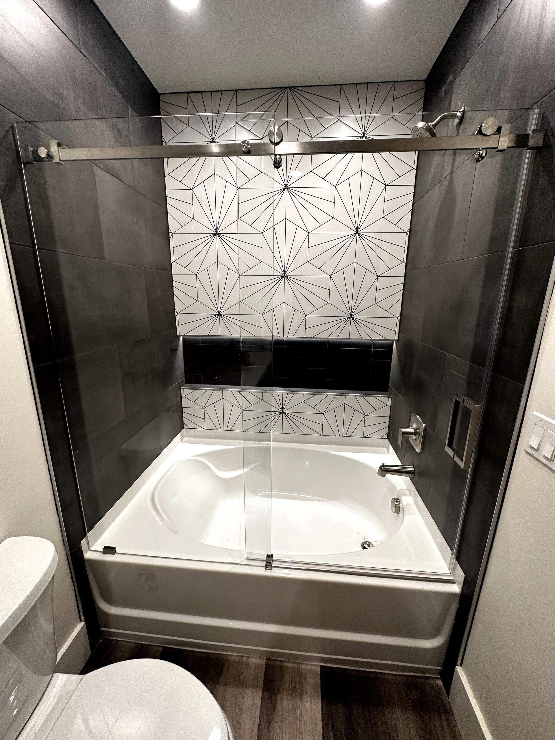 A bathroom with a bathtub and a toilet