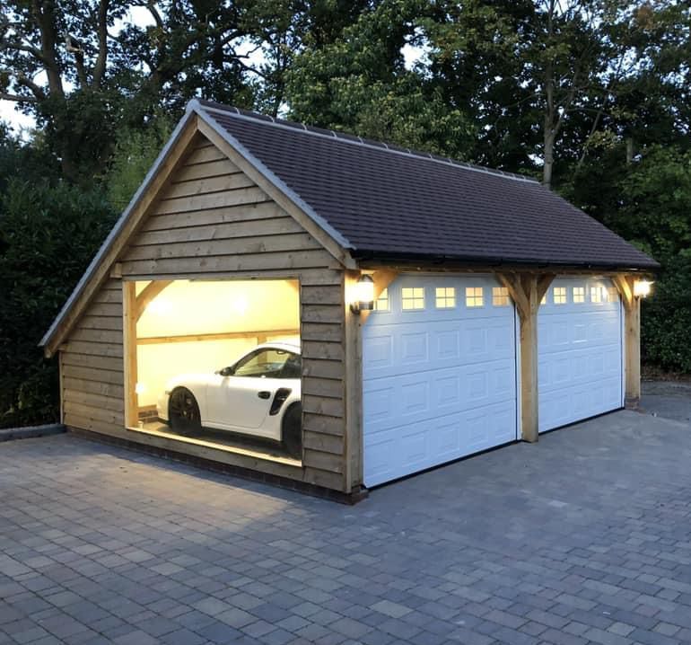 a car is parked in a garage with the door open