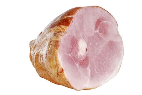 A close up of a piece of ham on a white background