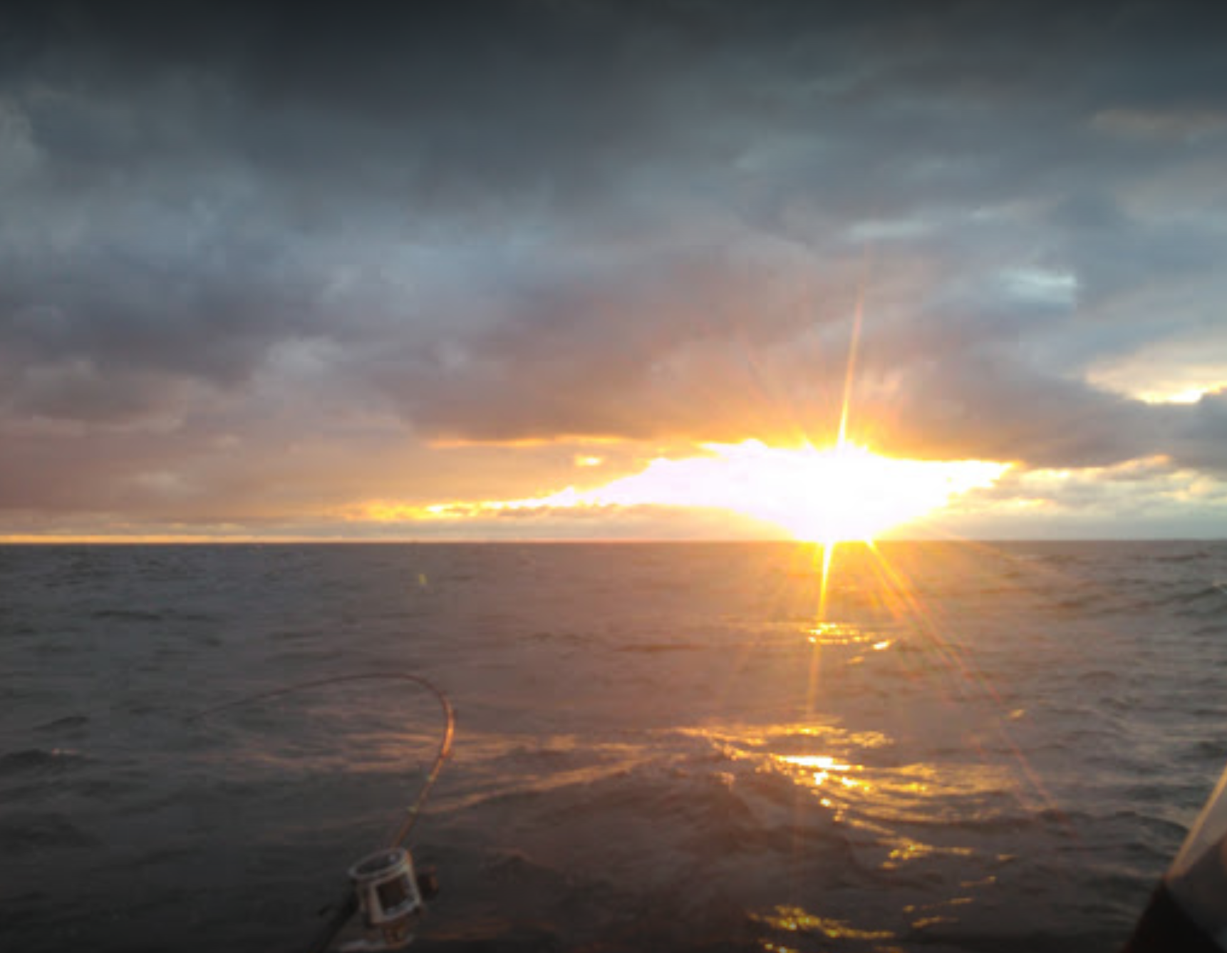 The sun is setting over a body of water