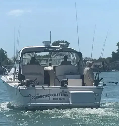 A boat with the word comomotion charters on the side