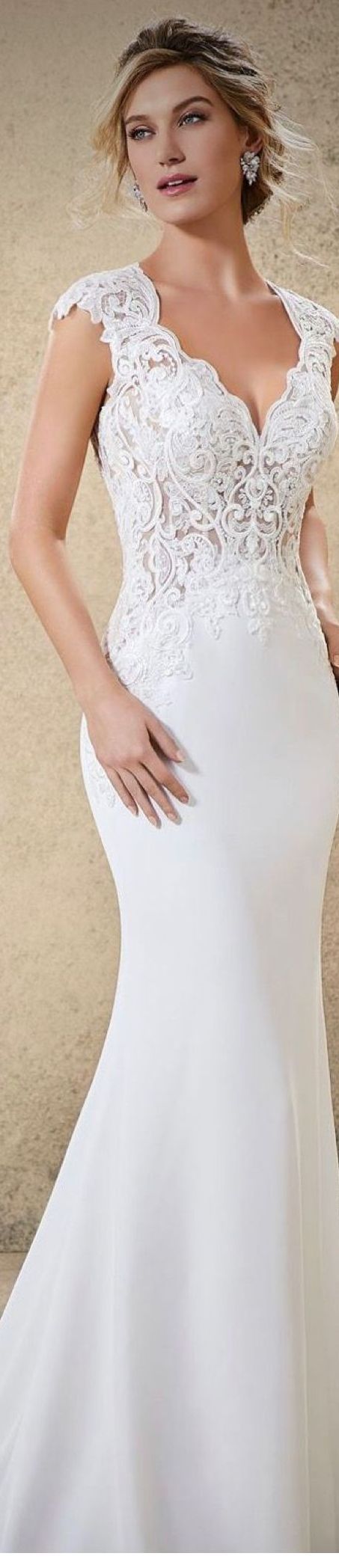 Woman in white wedding dress with lace bodice.