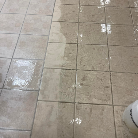 Robert's Cleaning and Restoration - A dirty tile floor with a white bowl on it