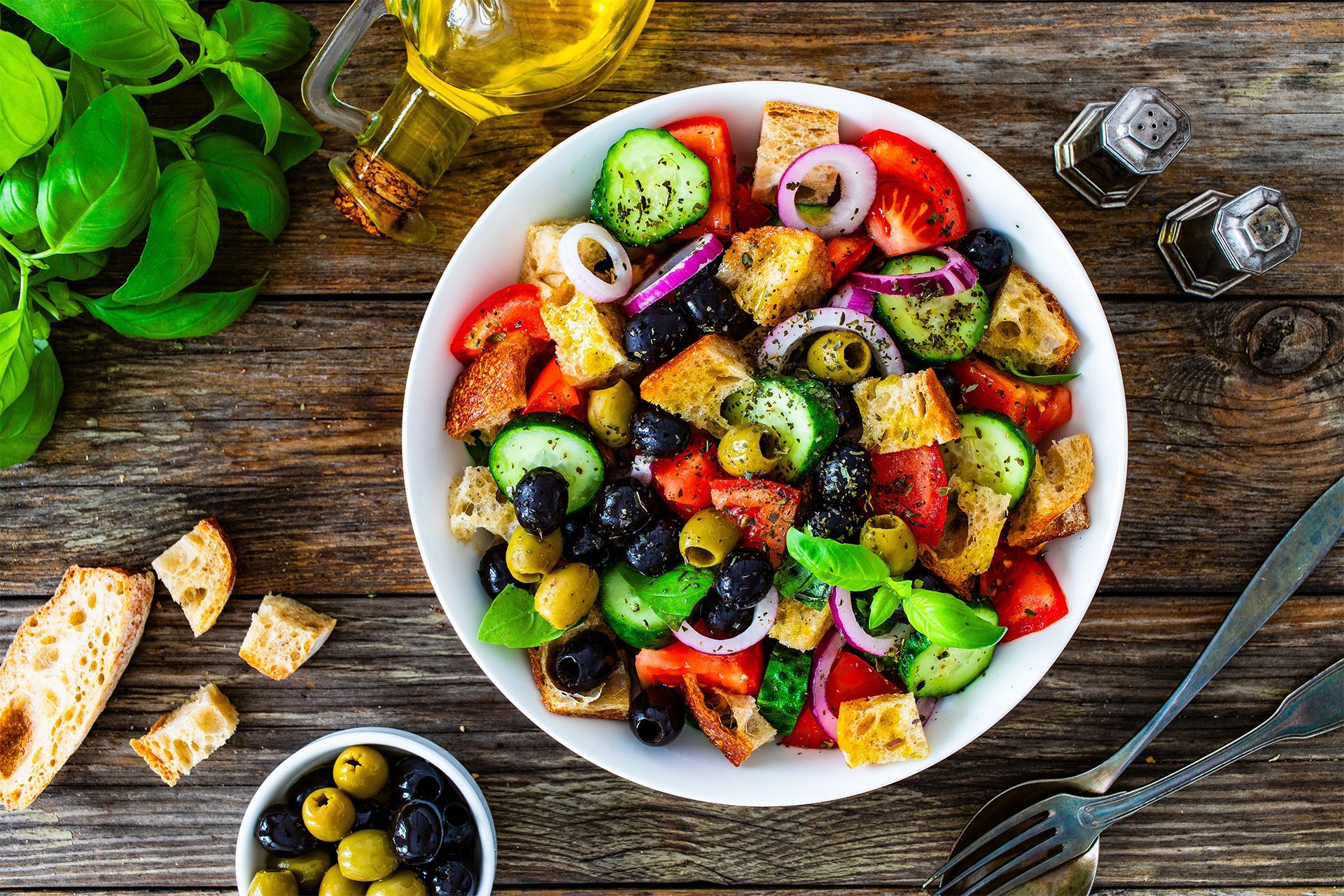 Colorful Italian salad with olives, tomatoes, cucumber, and feta.