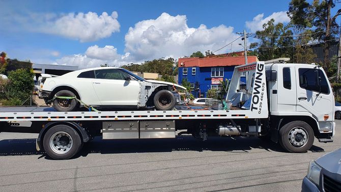a truck taking the car