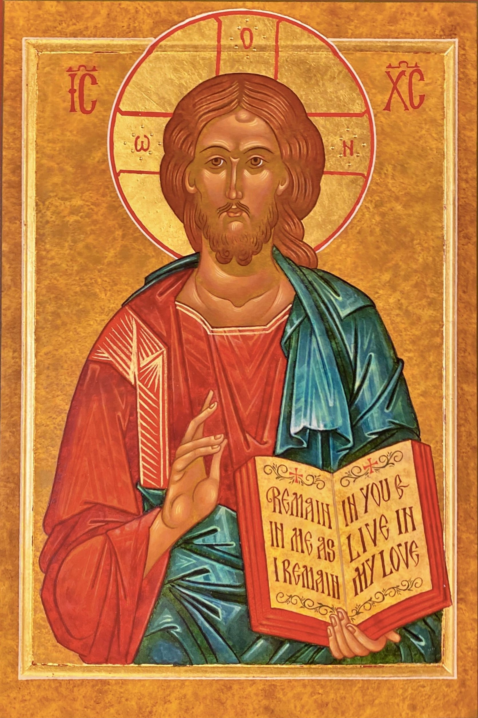 A religious icon of jesus holding a book.