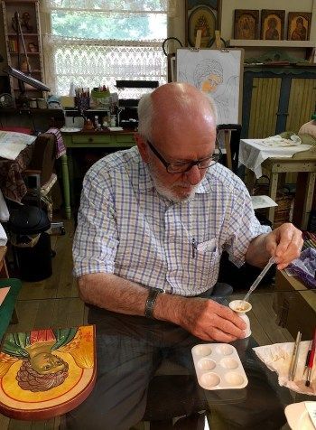 Father Rex works on an icon of the Archangel Gabriel at the studio in 2019.