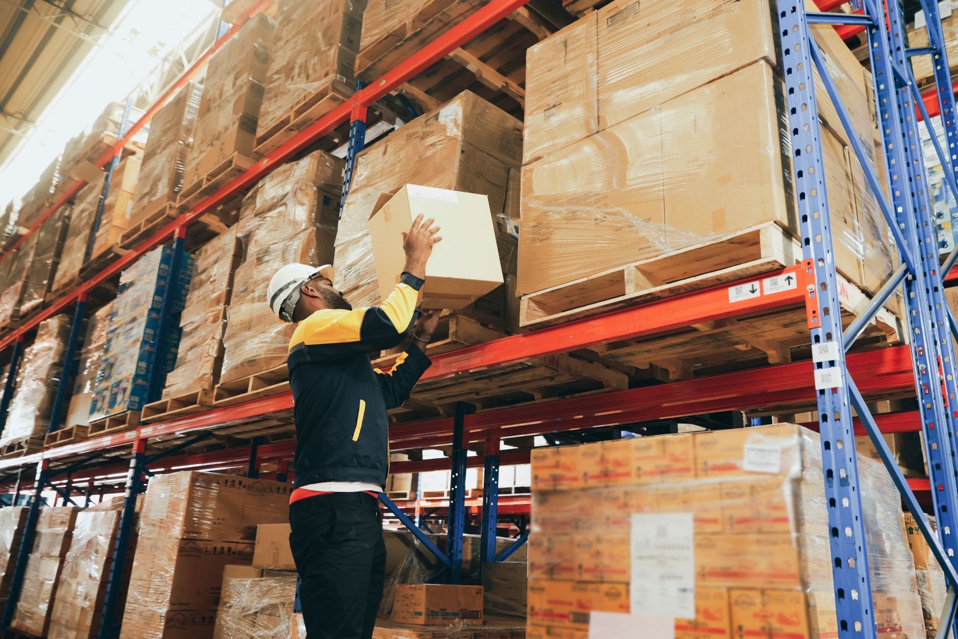 Commercial movers loading office furniture into a moving truck.