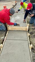 Finishing a concrete sidewalk in Elmhurst
