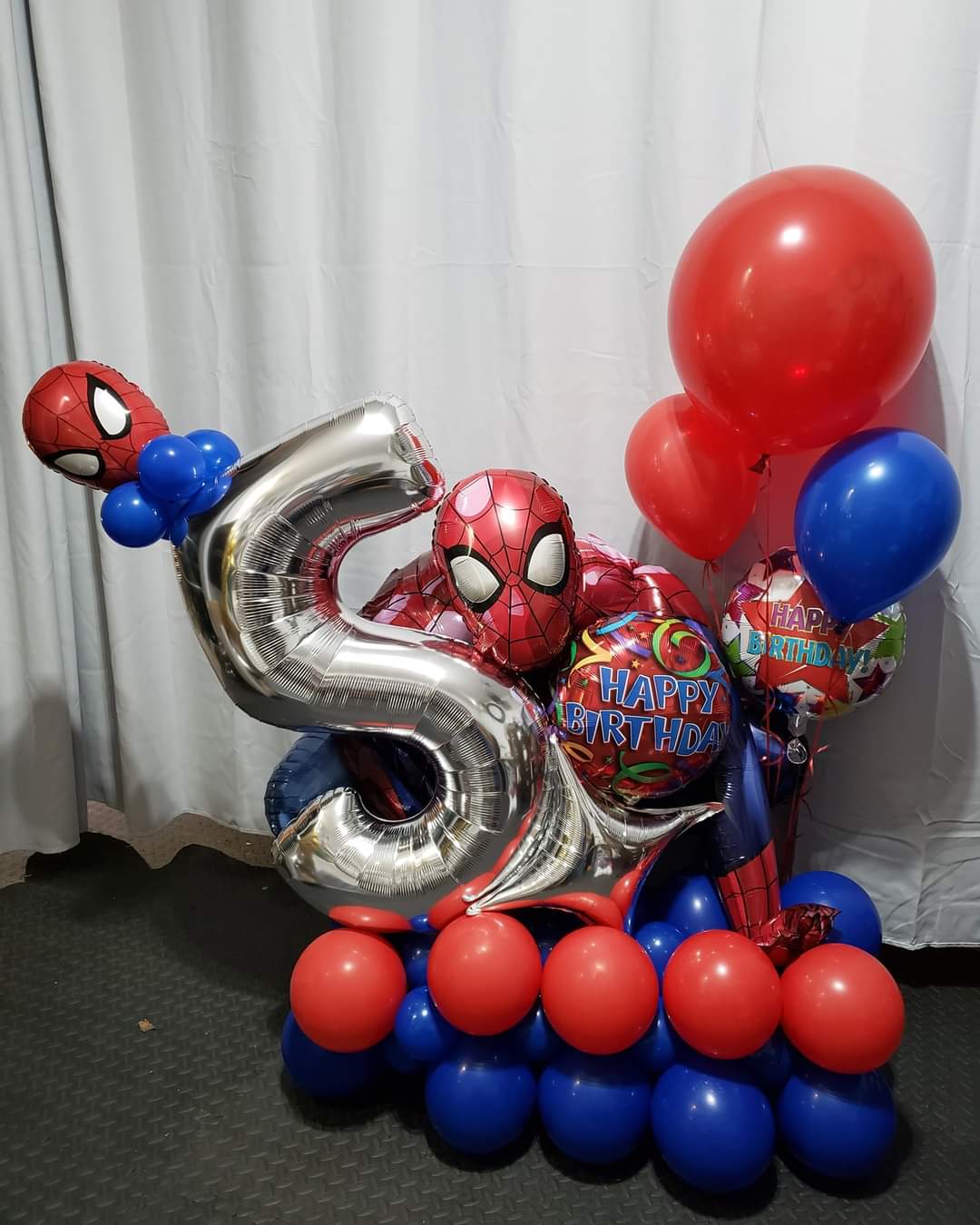 Birthday balloon marquee with spiderman theme, red, silver and blue. 