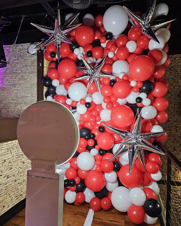 Super deluxe organic balloon wall. Red, white and black with silver foil starbursts. 