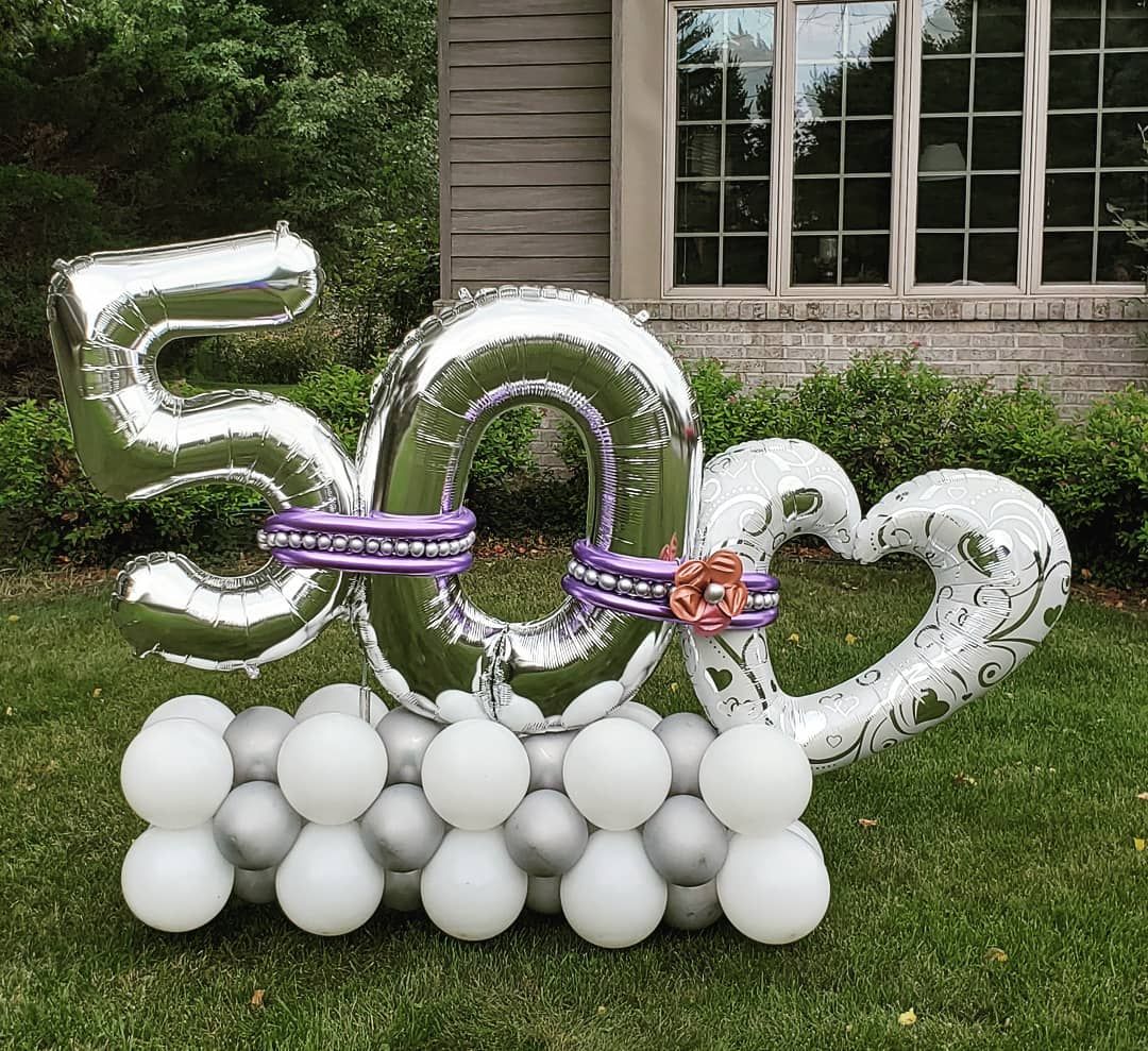50th anniversary celebration balloon marquee. Silver, purple colors. 
