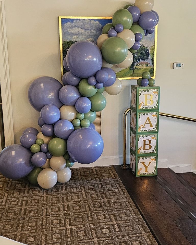 8ft Organic garland. Garland is attached to 4 vertically stacked boxes that spell out