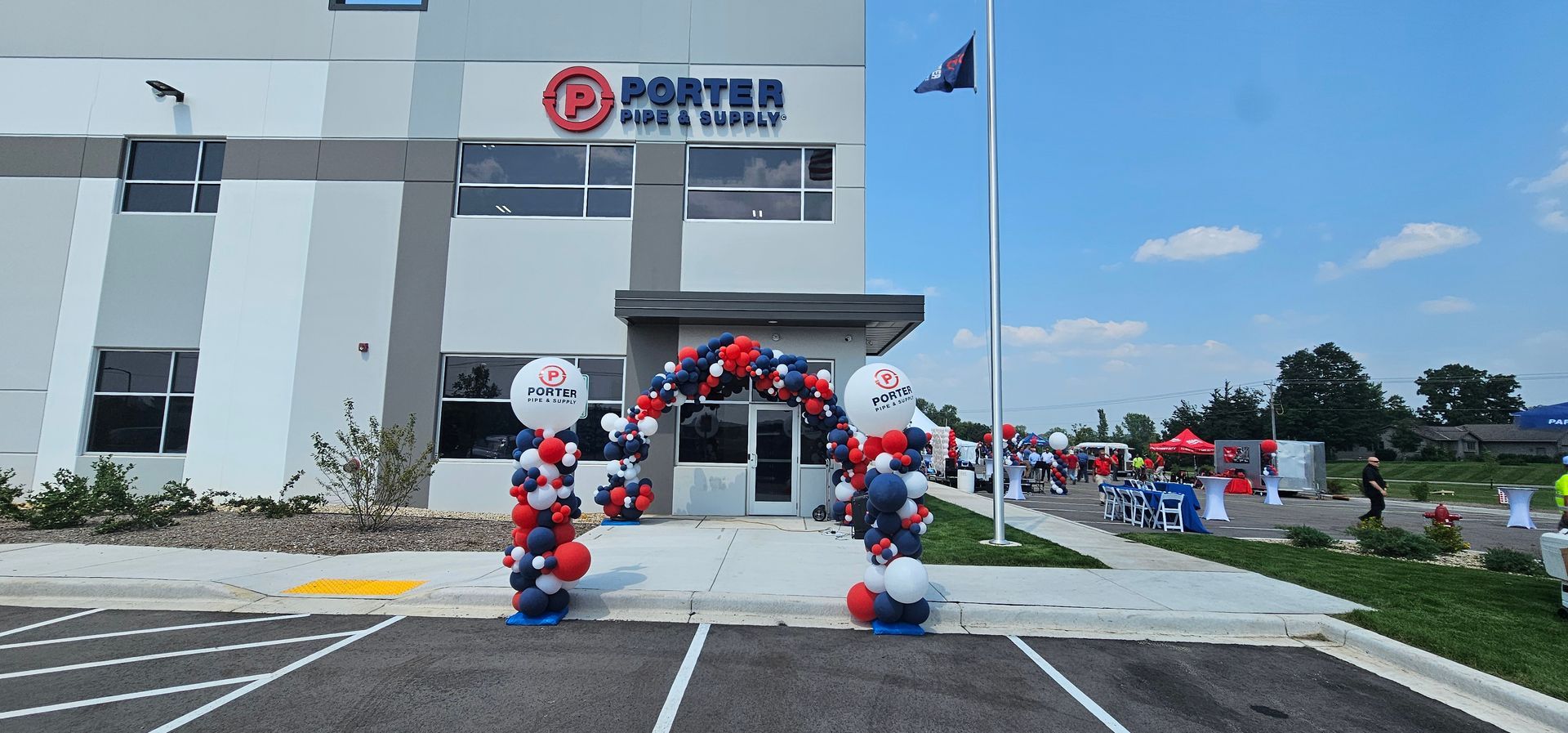 Organic full arch, red, white and blue for company grand opening. 
