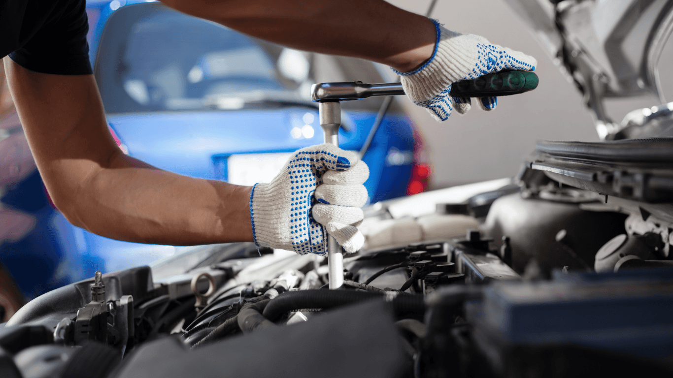 A mechanic doing a brake service.