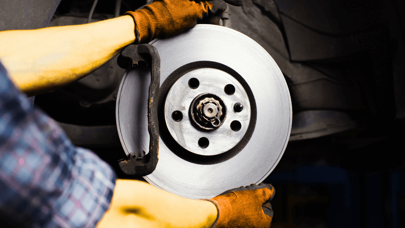 A mechanic doing a brake service.