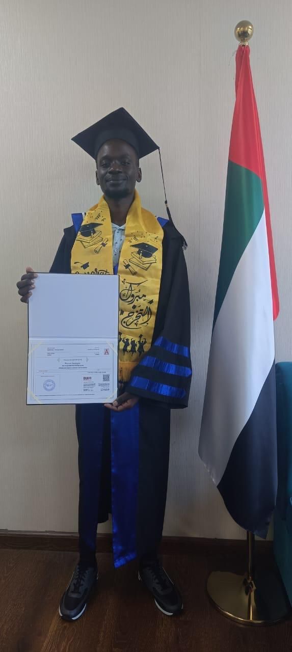 Aviation management course graduates posing with diplomas in Dubai classroom
