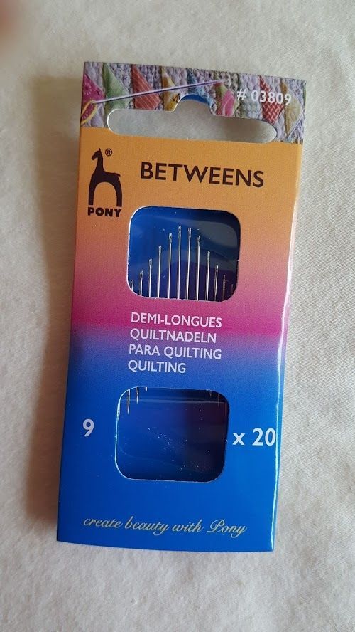 Pioneer Betweens quilting needles package, pink-to-blue box with clear window and 20-count label