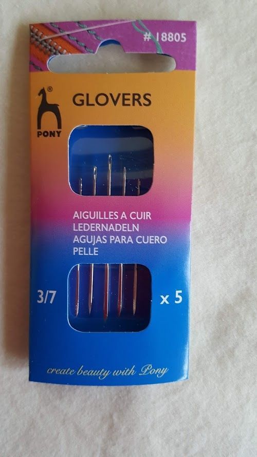 Glover’s leather sewing needles pack, pink and blue box with five needles visible in window