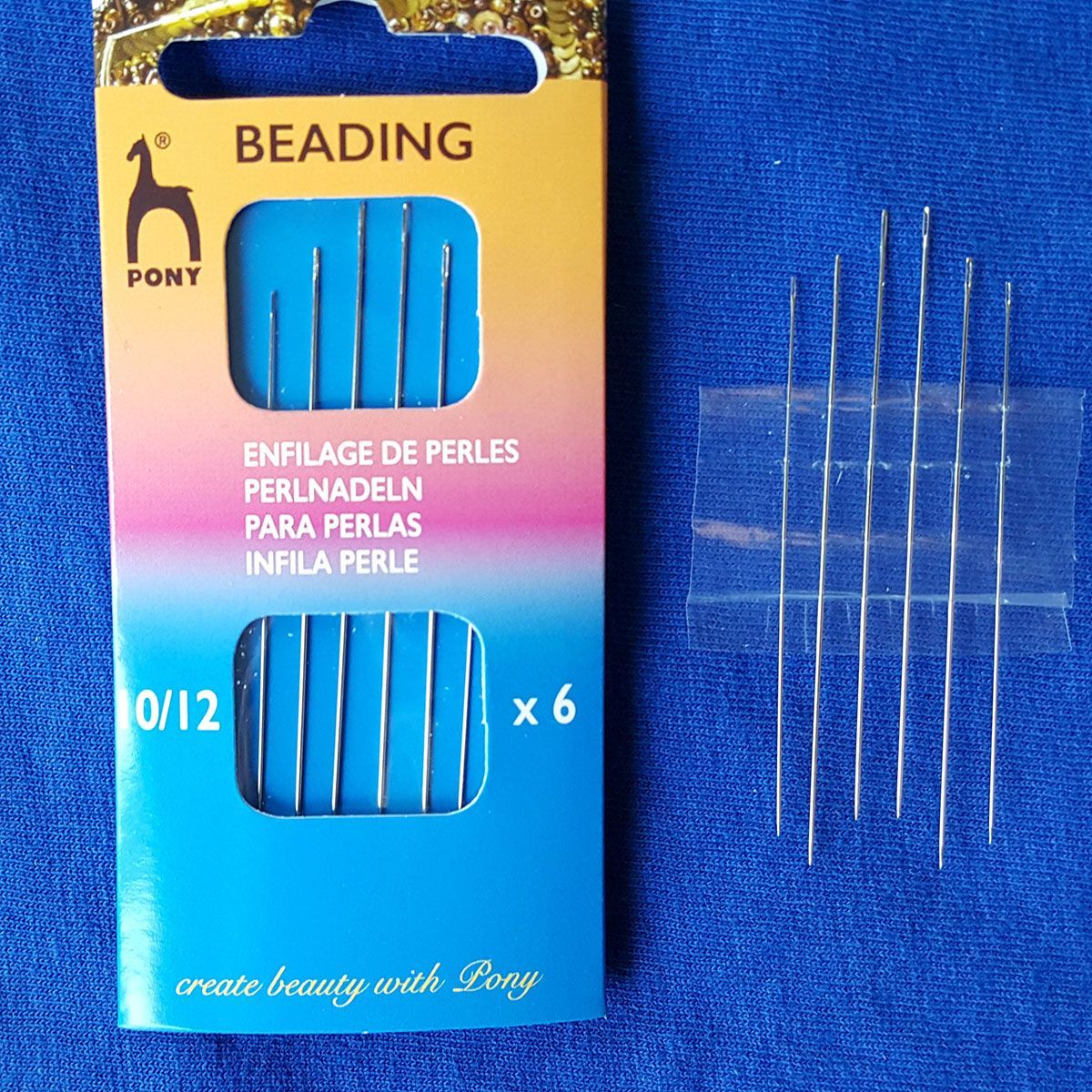 Package of Pony beading needles in blue-yellow box, with six needles shown beside it