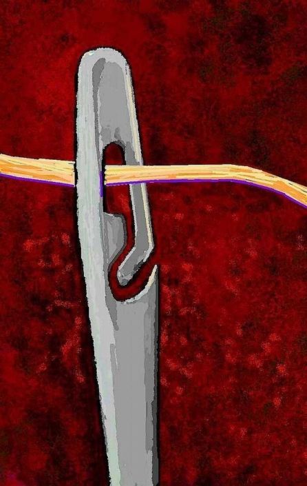 Close-up of a spiral eye needle eye holding a yellow and purple wire against a red background