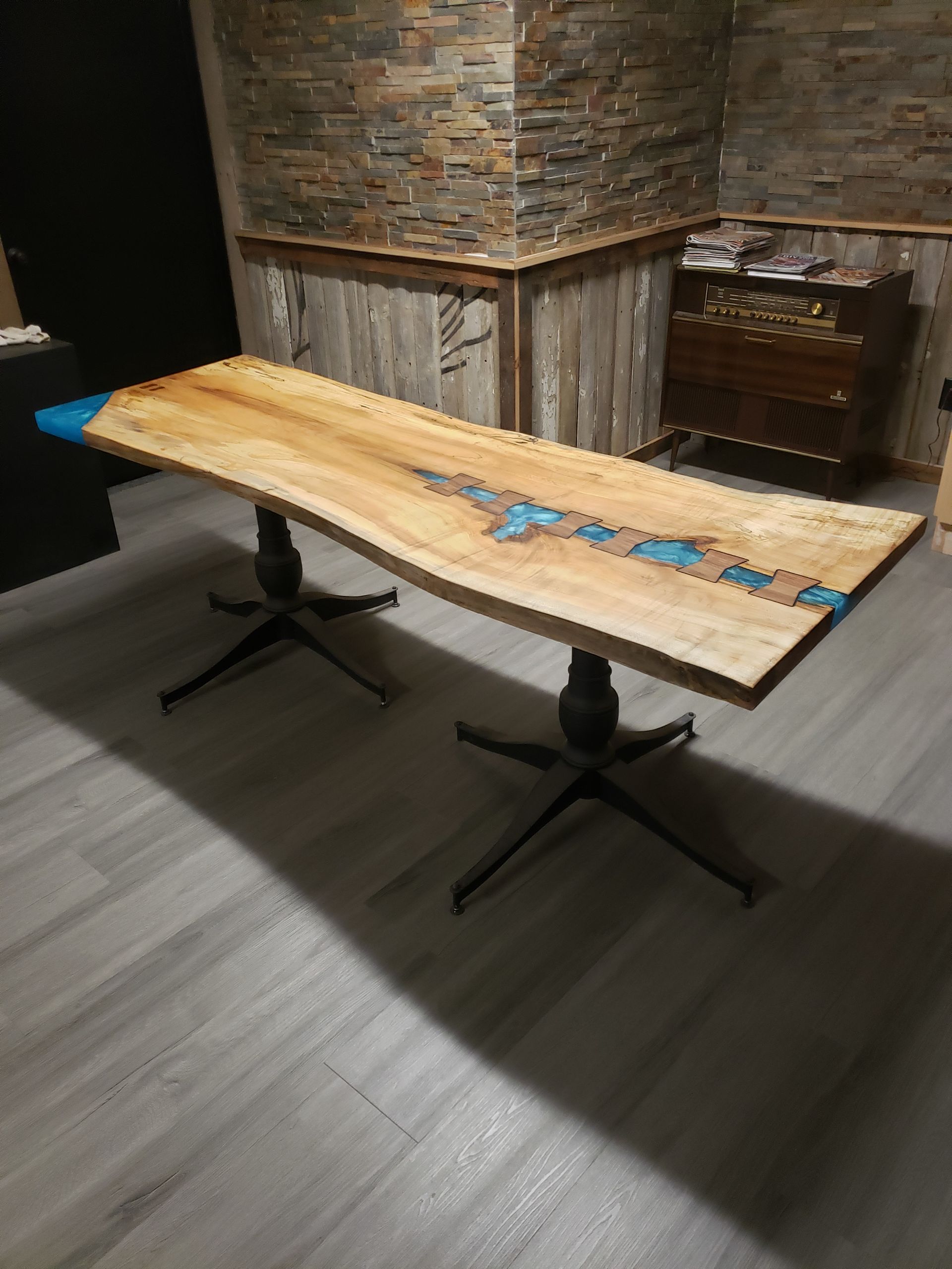 Full size custom epoxy pour desk with joins inlaid, side view