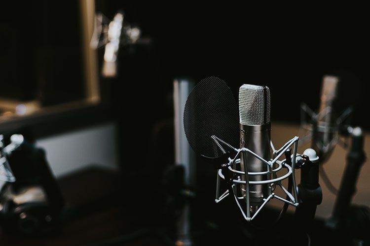 A close up of a microphone in a recording studio.