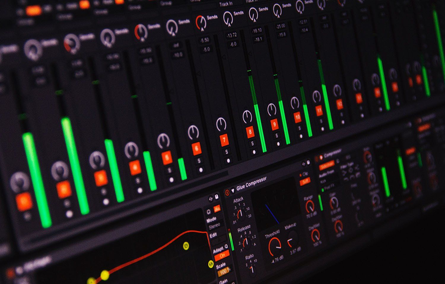A row of mixers with green lights on them