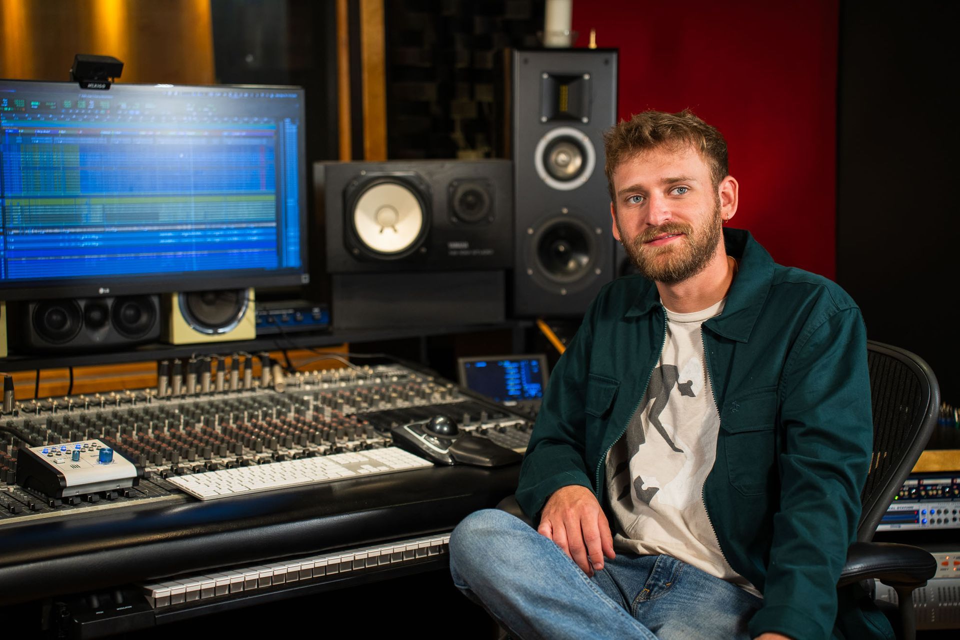 Sebastien Laviolette sitting in front of an audio console as the lead recording engineer at SLR Studios in Windsor Ontario Canada.