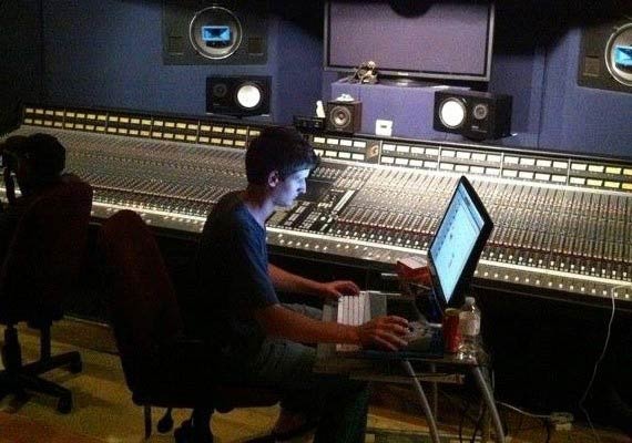 Dana Liska in studio working on audio mixing for independent label.