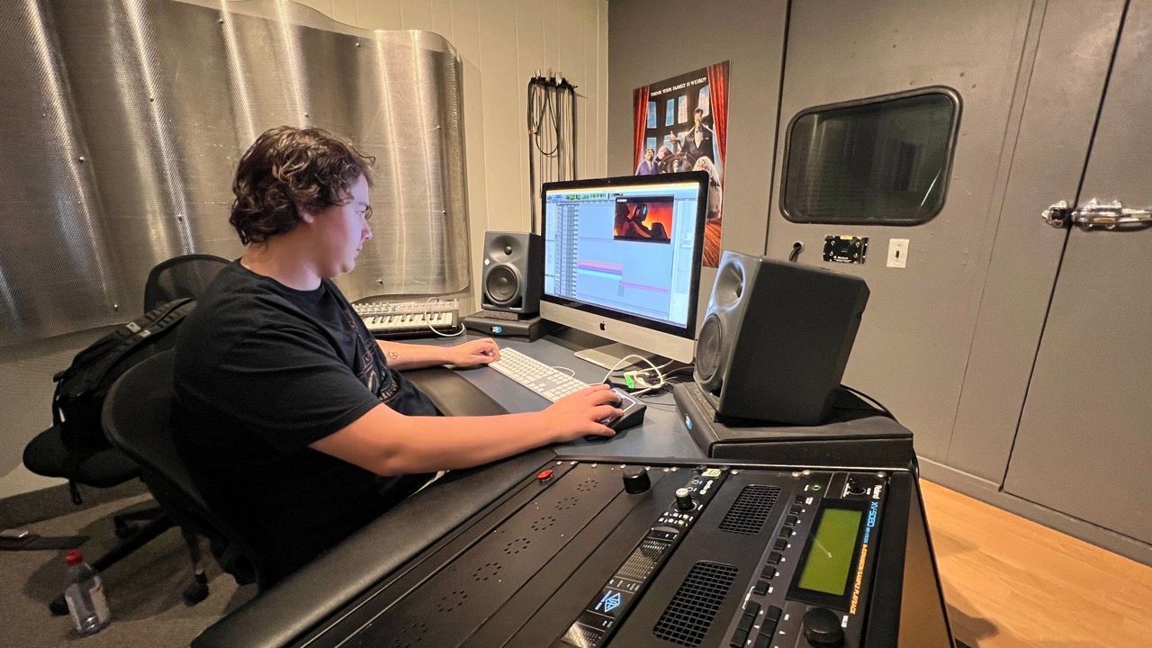 Person working on modern program for class as OIART