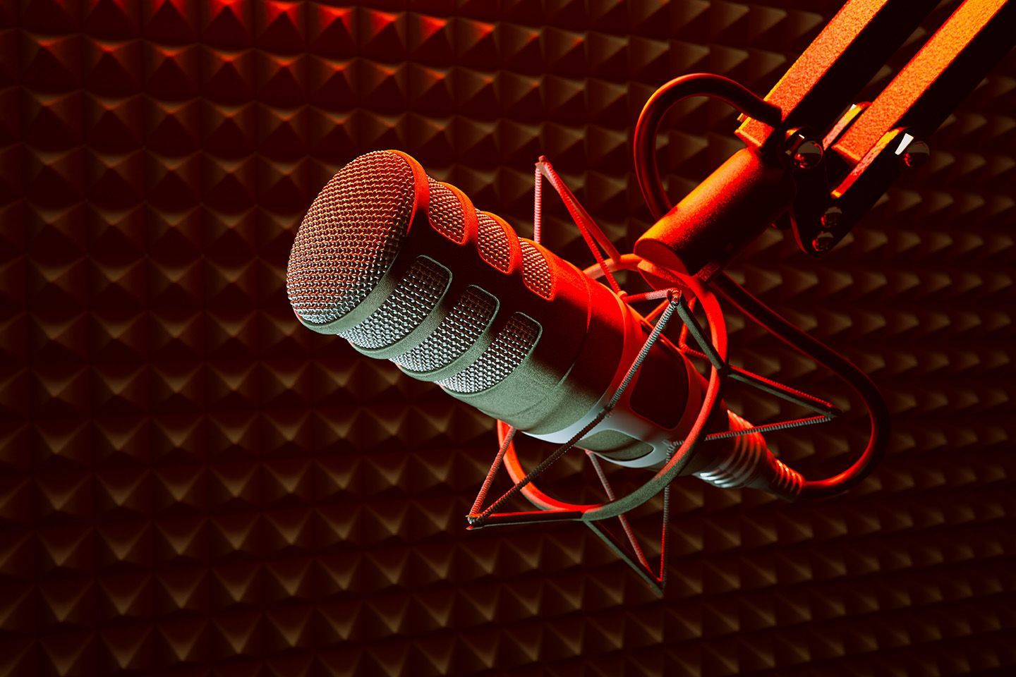A close up of a microphone against a red background