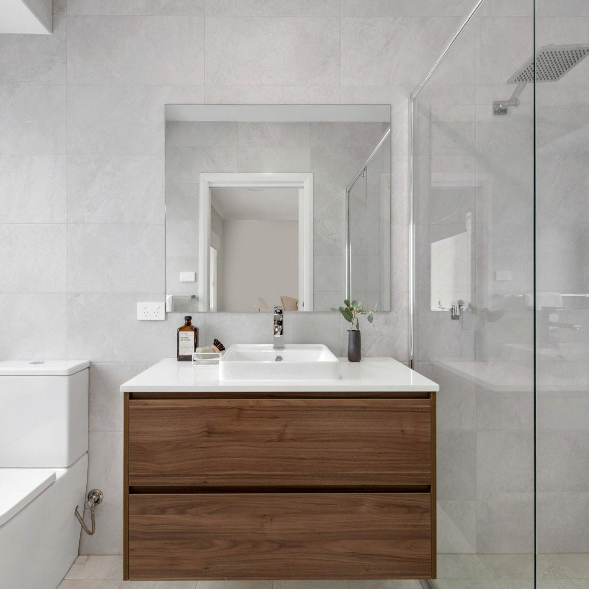 A Bathroom with A Sink, Mirror, Toilet and Bathtub — Evolution Building Group Dapto, NSW