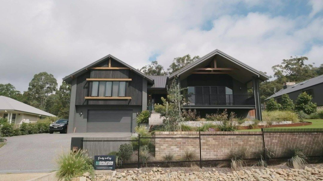 A Large House with A Car Parked in Front of It — Evolution Building Group Dapto, NSW