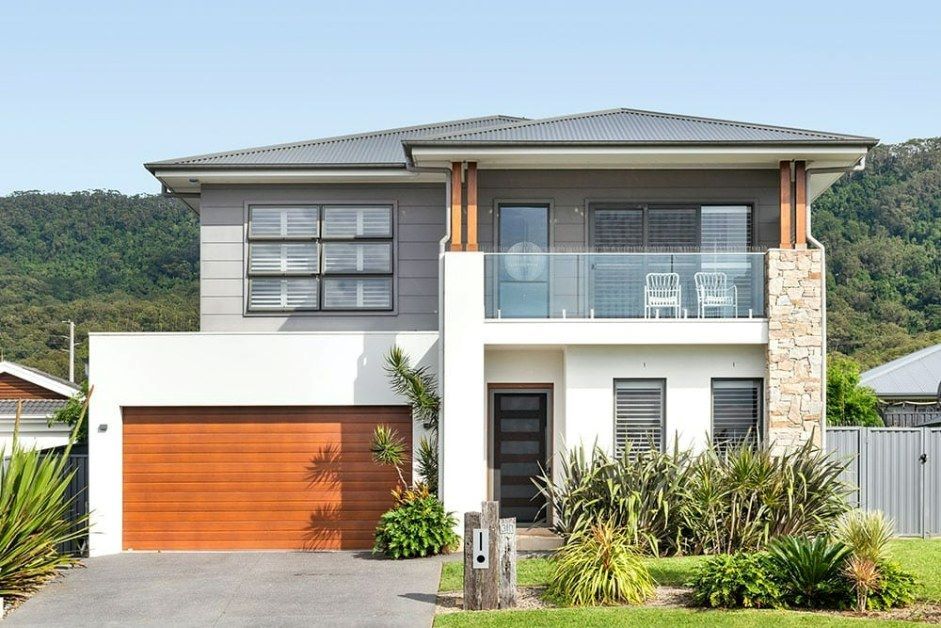 A Modern House with A Large Garage and A Balcony — Evolution Building Group Dapto, NSW