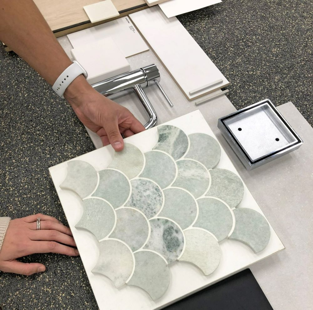A Person Is Holding a Tile that Looks Like a Fish Scales Pattern — Evolution Building Group Dapto, NSW