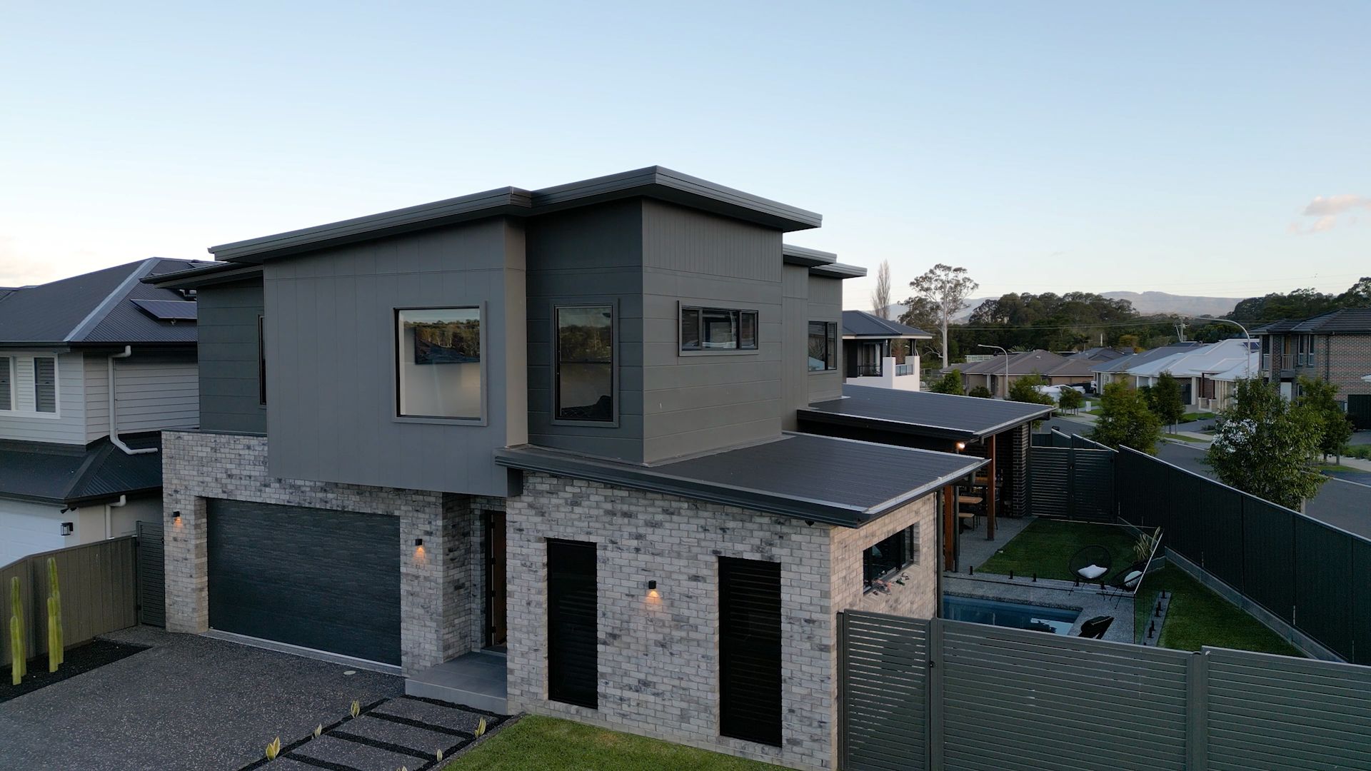 Modern Two-story Grey House With a Garage and Front Porch — Evolution Building Group in Dapto, NSW
