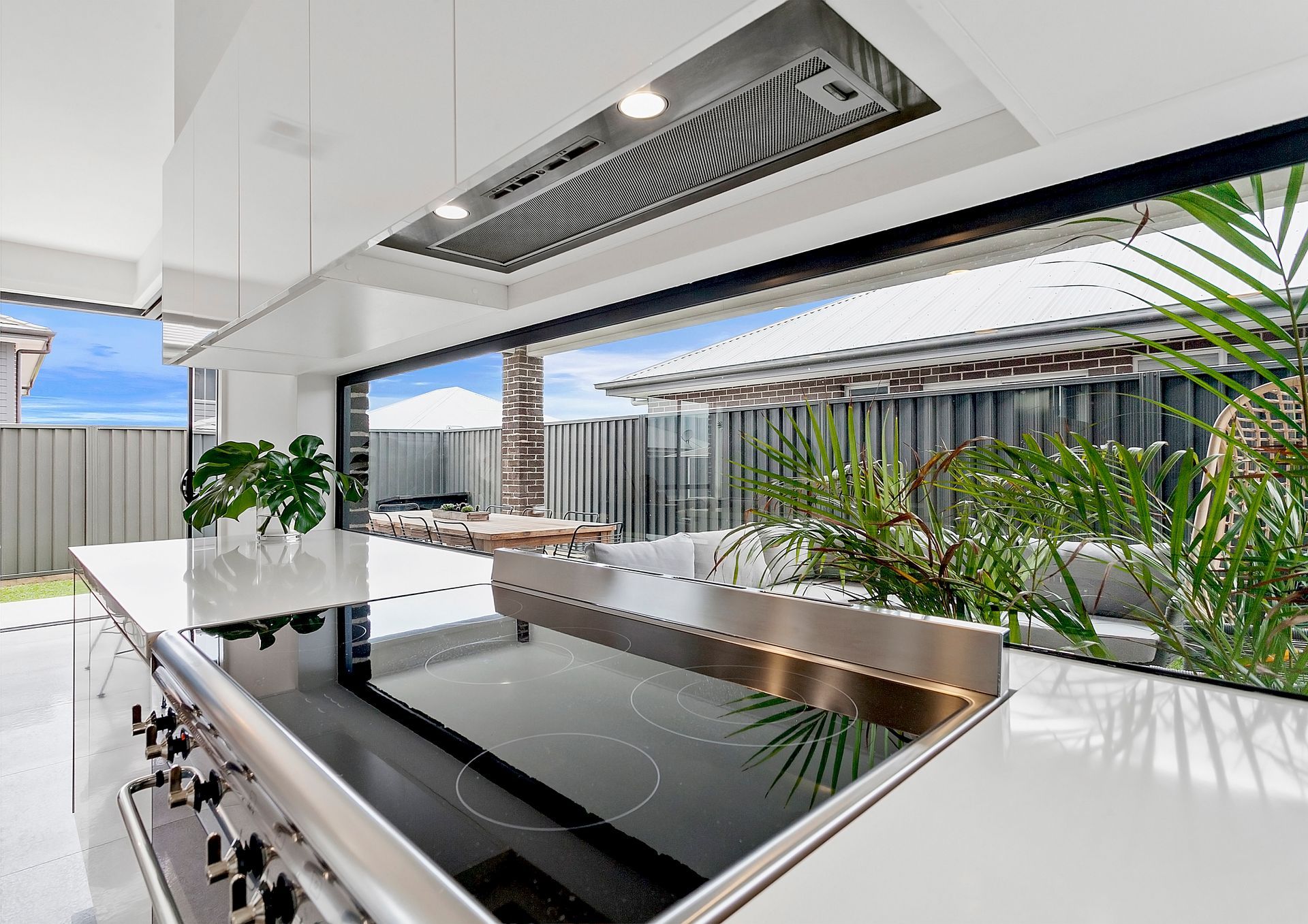 Kitchen With Cooktop, Counters, and Large Windows — Evolution Building Group in Dapto, NSW