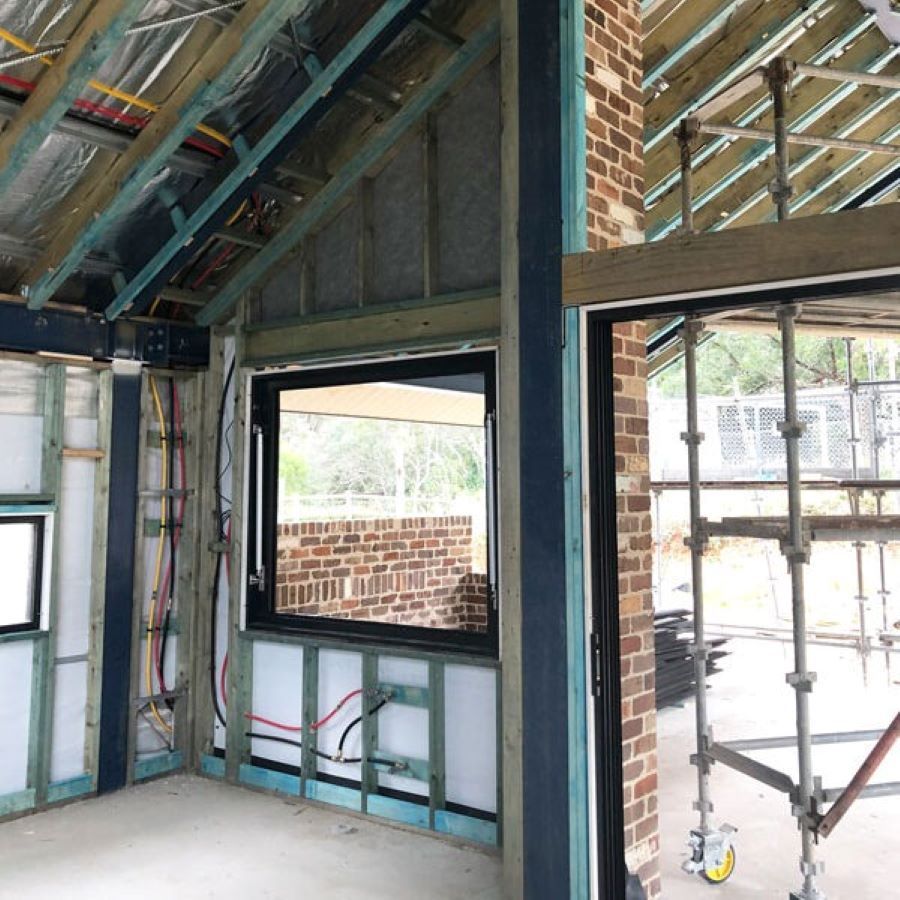 A Room Under Construction with A Window and Scaffolding — Evolution Building Group Dapto, NSW