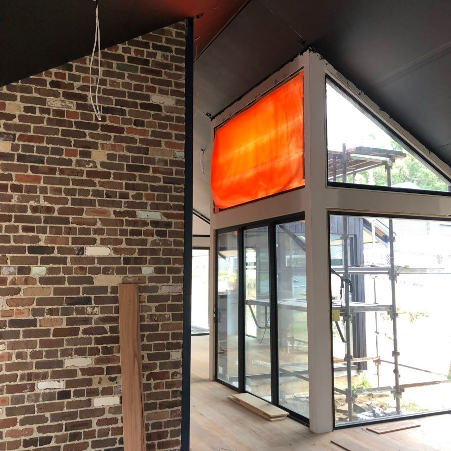 A Room with A Brick Wall and A Large Window — Evolution Building Group Dapto, NSW