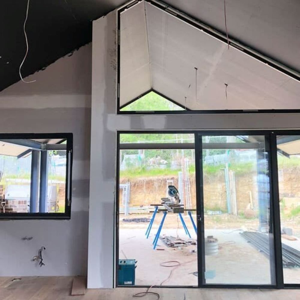 A Room with A Lot of Windows and A Sliding Glass Door — Evolution Building Group Dapto, NSW