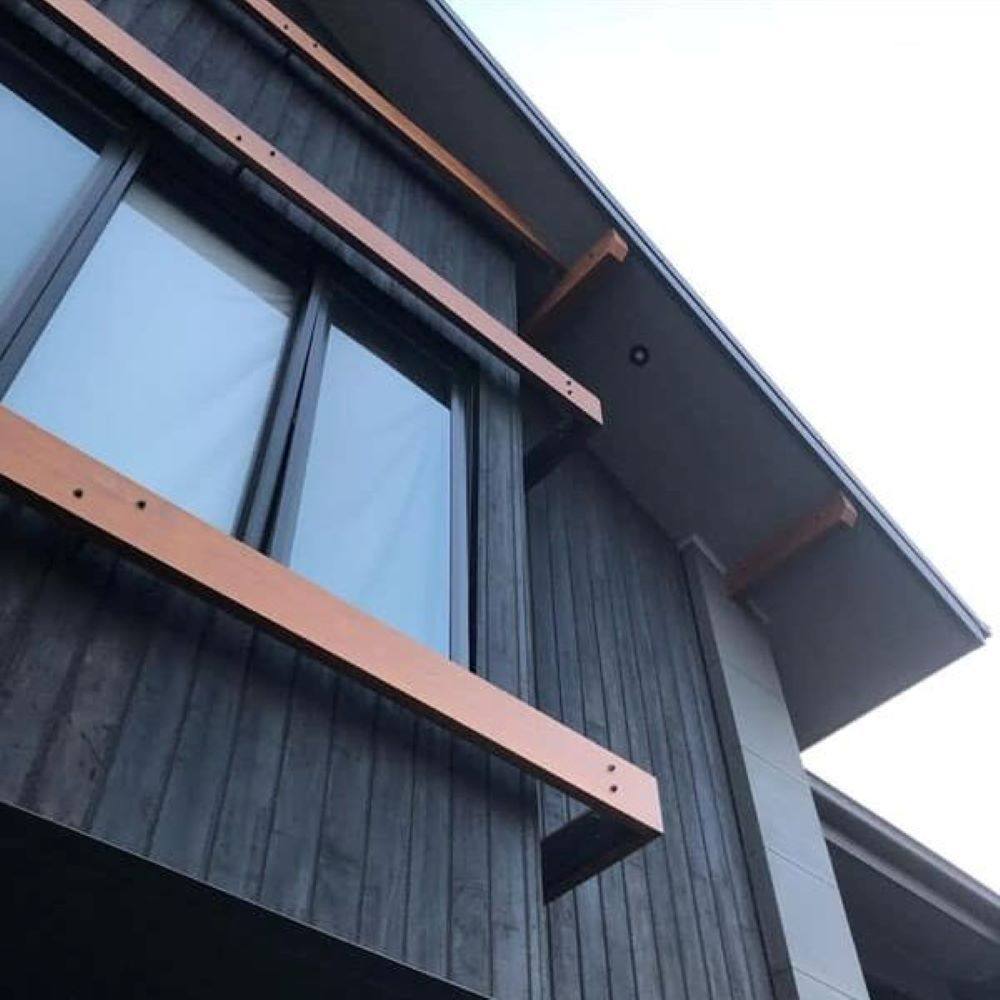 Looking up At a House with A Wooden Balcony — Evolution Building Group Dapto, NSW