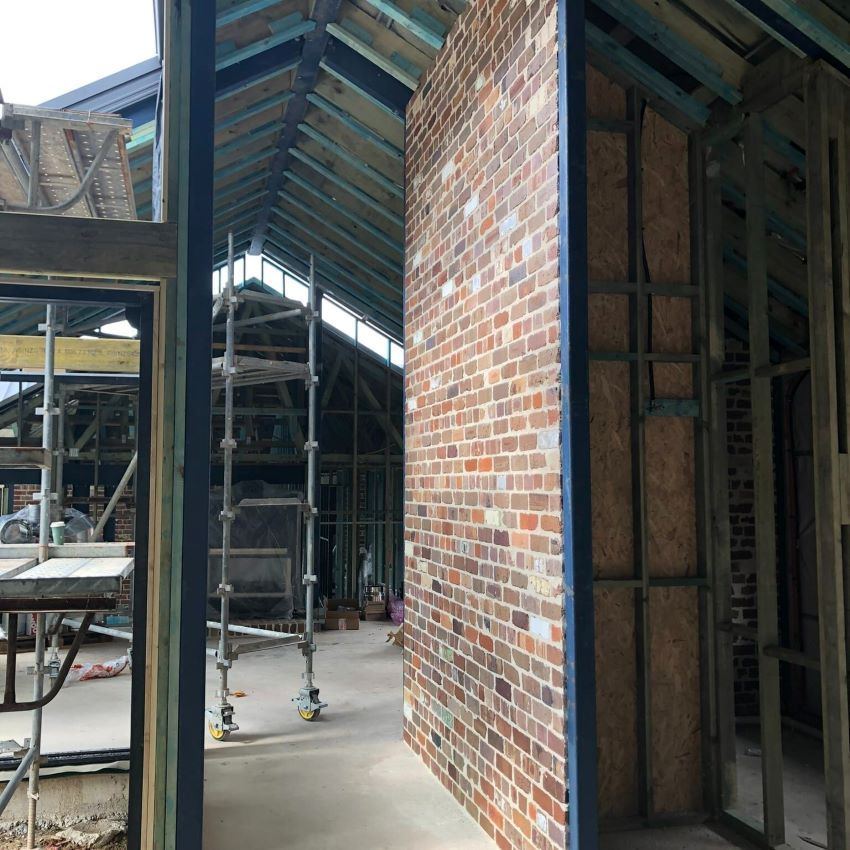 A Building Under Construction with Brick Walls and Scaffolding — Evolution Building Group Dapto, NSW
