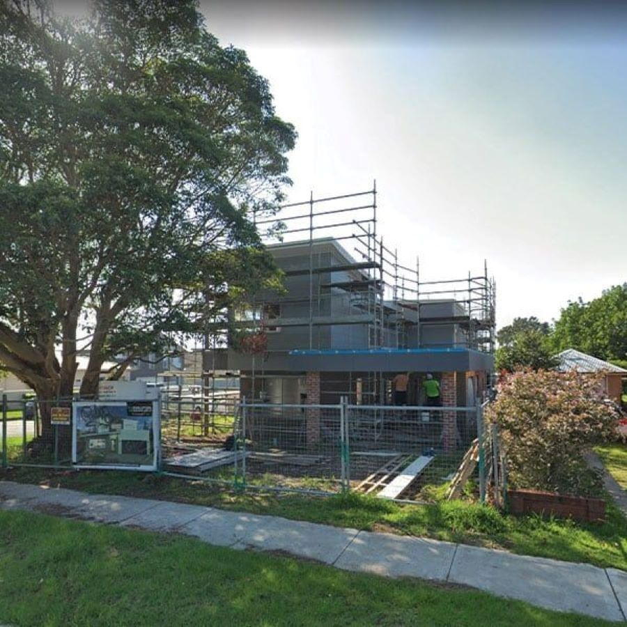 A House Is Being Built with Scaffolding Around It — Evolution Building Group Dapto, NSW