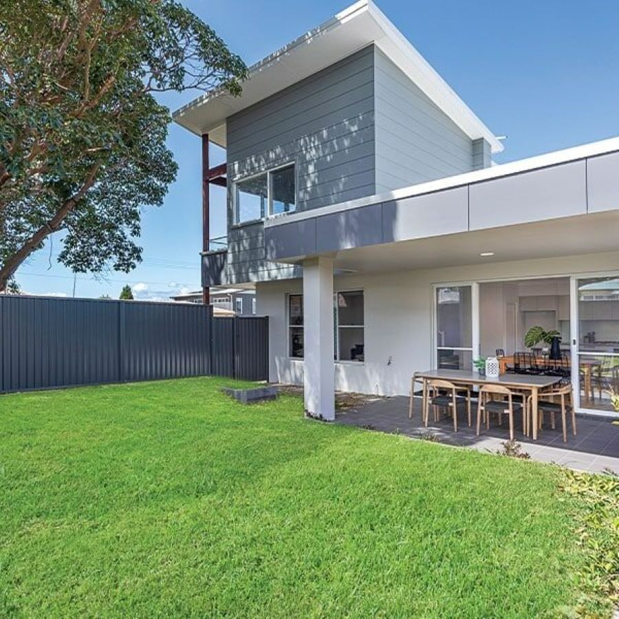 A Large House with A Large Lawn in Front of It — Evolution Building Group Dapto, NSW