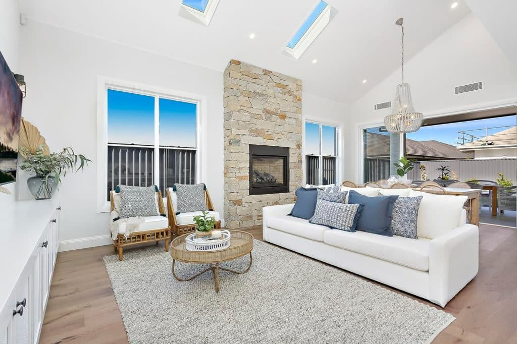 A Living Room with A Couch, Chairs, and A Fireplace — Evolution Building Group Dapto, NSW