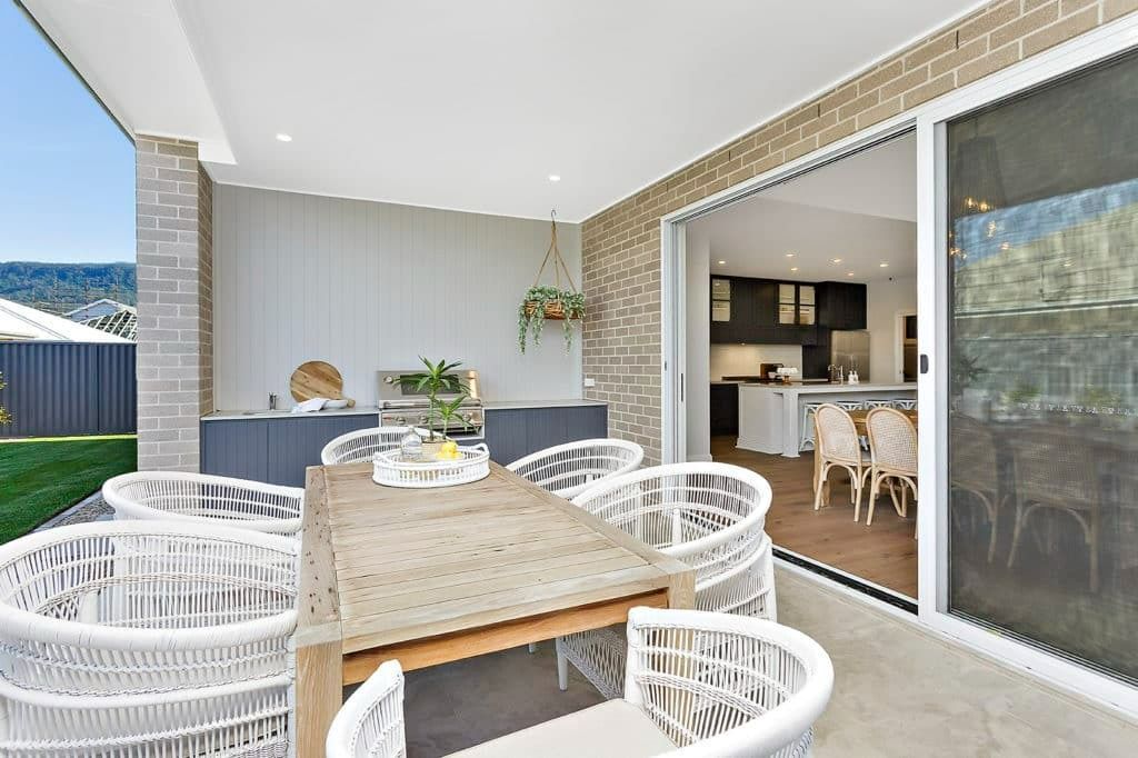 There Is a Table and Chairs on The Patio of A House — Evolution Building Group Dapto, NSW